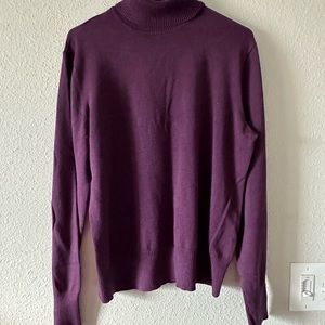 Woman’s turtleneck long sleeve top